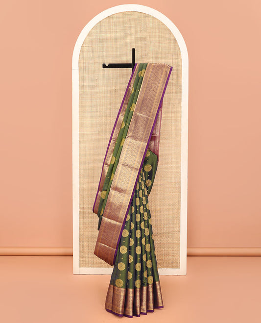 Green Vasundhara Lite Silk Mix Saree Highlighted with Chakram Buttas, Accentuated by a Contrast Border Featuring Rekku, Muthu, Kathir, Chakram, Star, and Mayil Designs, Pallu of Jaal design, and a Contrast Blouse