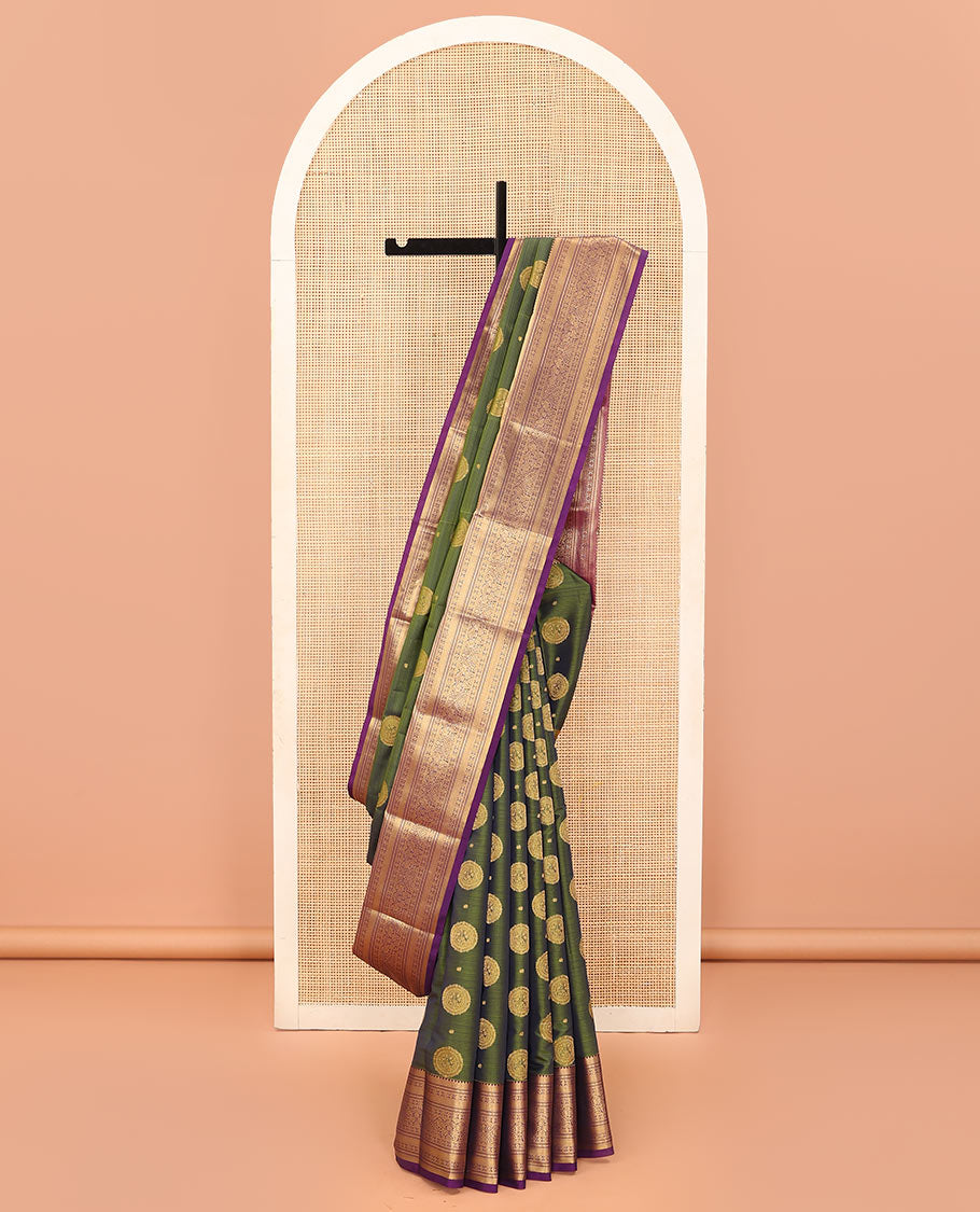 Green Vasundhara Lite Silk Mix Saree Highlighted with Chakram Buttas, Accentuated by a Contrast Border Featuring Rekku, Muthu, Kathir, Chakram, Star, and Mayil Designs, Pallu of Jaal design, and a Contrast Blouse