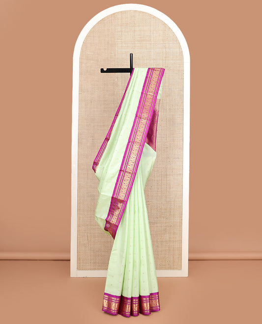 Green zari buttas silk saree, contrast border of thilakam mokku, kathir, banaras, and vanki manga kodi designs, and jaal pallu