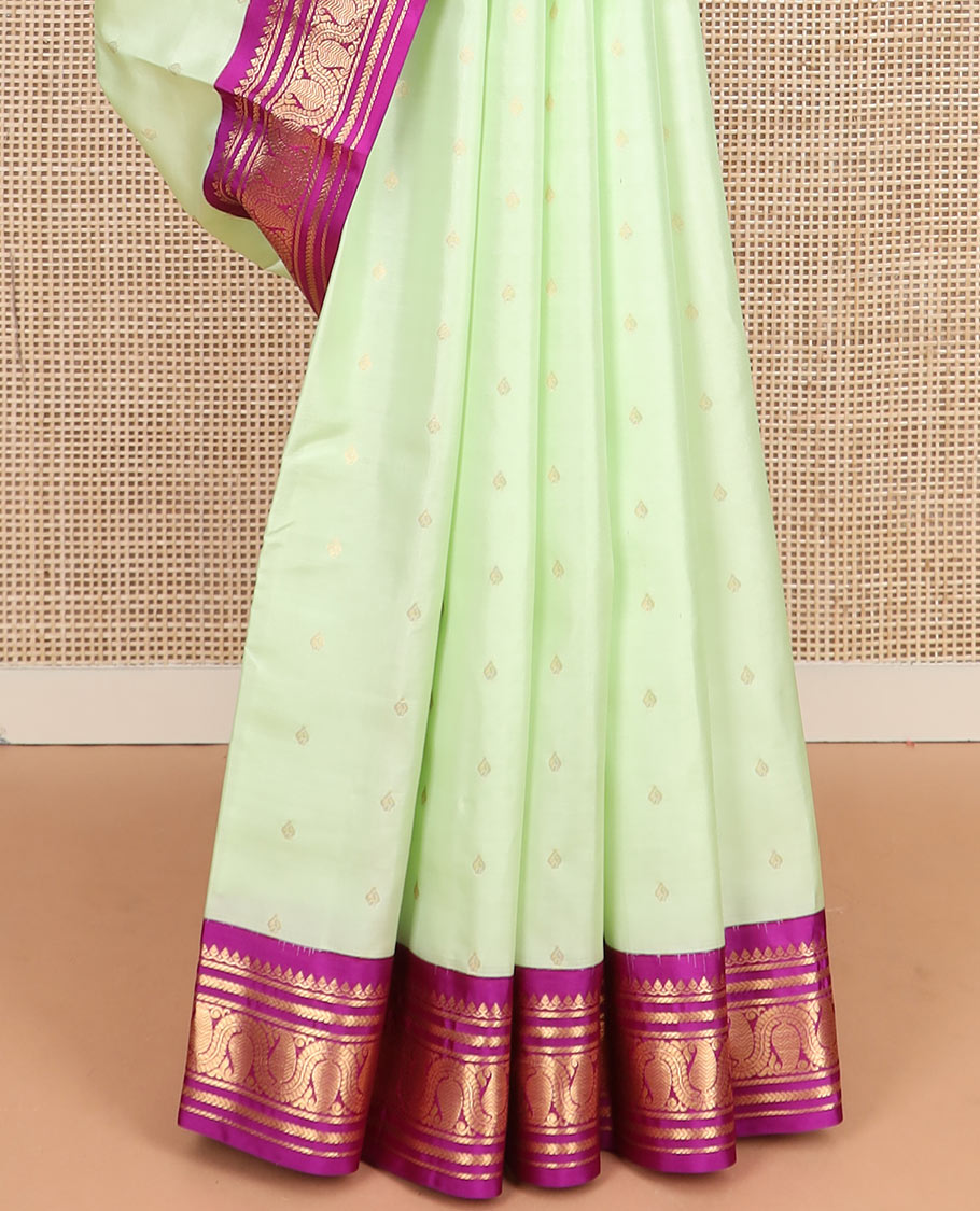 Green zari buttas silk saree, contrast border of thilakam mokku, kathir, banaras, and vanki manga kodi designs, and jaal pallu
