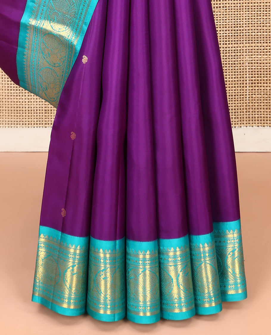 Violet Vasundhara Silk Saree, Subtly Sparkled With Zari Buttas All Over Its Body, Complemented by Zari Buttas All Over Its Body, Complemented by Contrast Border of Thilakam, Banaras, and Mayil Designs Grand Jaal Pallu and Paired with a Contrast Blouse