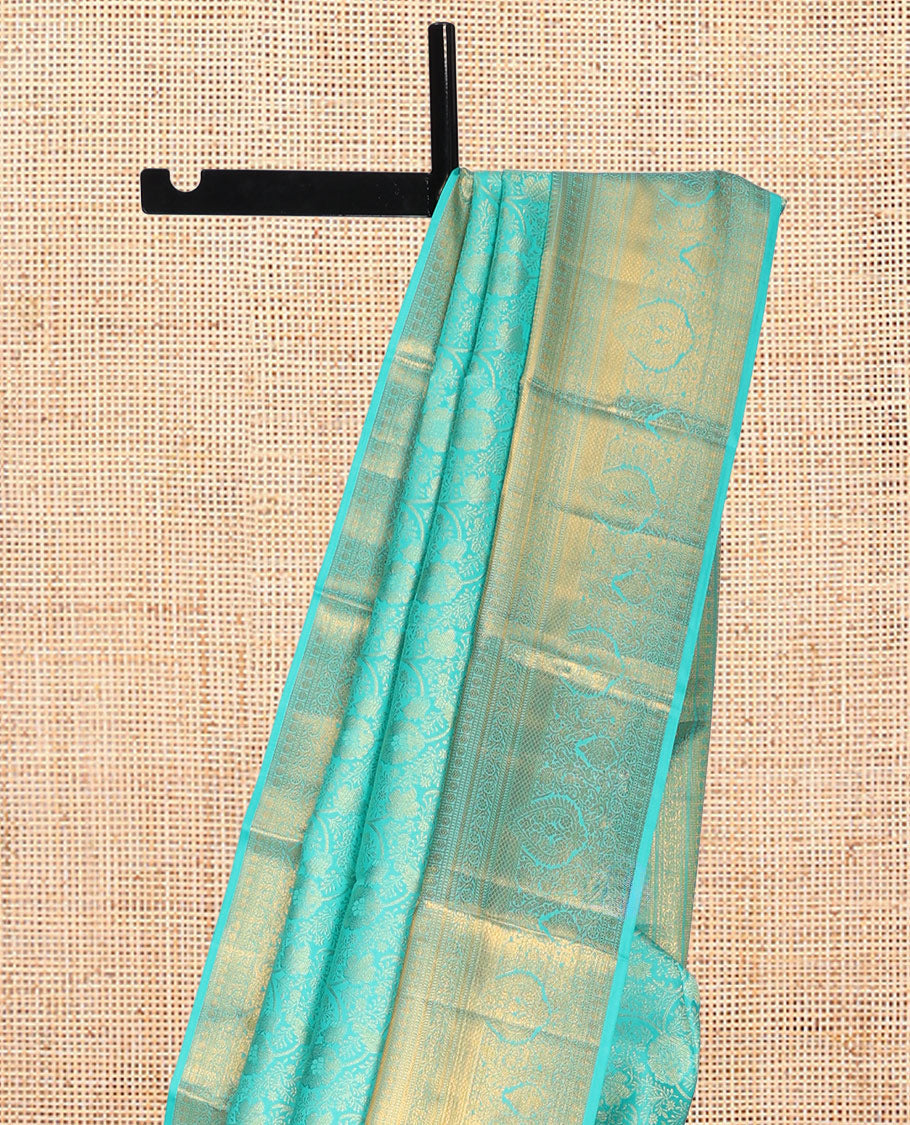 Turquoise Jacquard Kanchipuram Wedding Silk Saree, Highlighted by a Zari Border of Rekku, Muthu, Poun, Kodi Visiry, and Mayil Kann Designs, Grand Pallu, and Matching Blouse