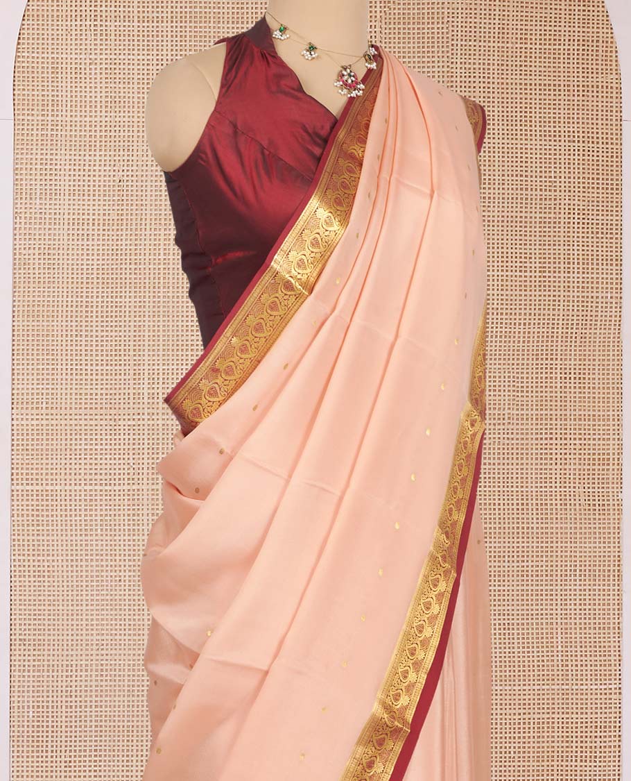 Light Peach Mysore Silk Saree, Mesmerized with Zari Buttas All Over Its Body, Complemented by a Contrast Traditional Zari Design Border, Zari-Buttas Woven Pallu, and Paired with a Contrast Blouse
