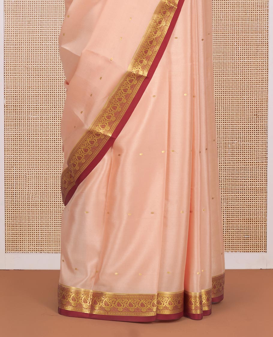 Light Peach Mysore Silk Saree, Mesmerized with Zari Buttas All Over Its Body, Complemented by a Contrast Traditional Zari Design Border, Zari-Buttas Woven Pallu, and Paired with a Contrast Blouse