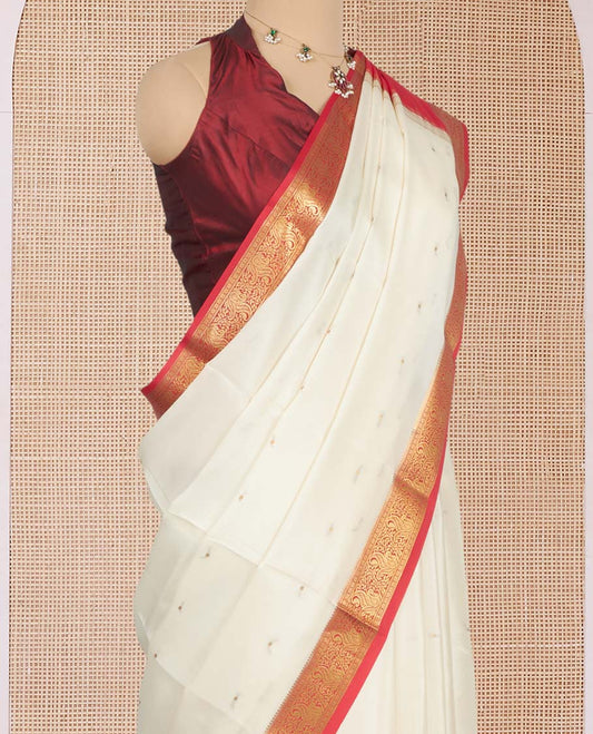 White Mysore Silk Saree, Sparsely Sparkled with Zari Buttas All Over Its Body, Complemented by a Contrast Traditional Zari Design Border, Zari-Buttas Woven Pallu, and Paired with a Contrast Blouse