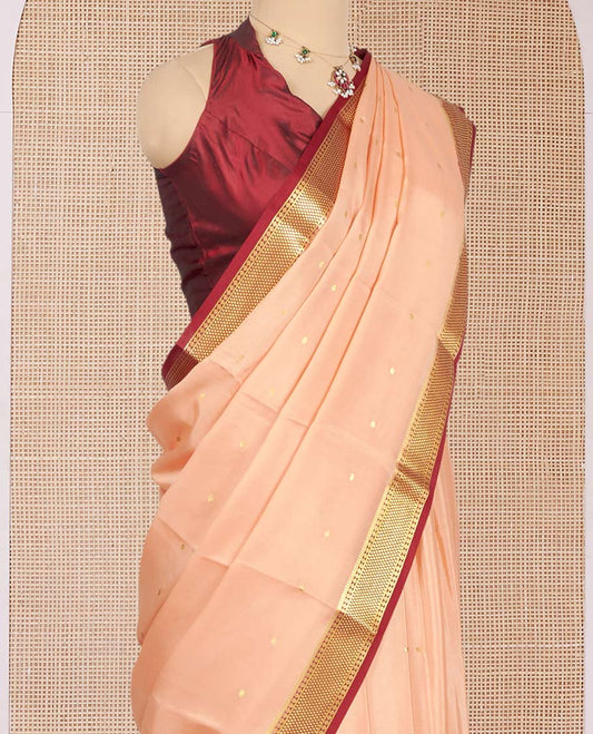 Cantaloupe Orange Mysore Silk Saree, Mesmerized with Zari Buttas All Over Its Body, Complemented by a Contrast Traditional Zari Design Border, Zari-Buttas Woven Pallu, and Paired with a Contrast Blouse