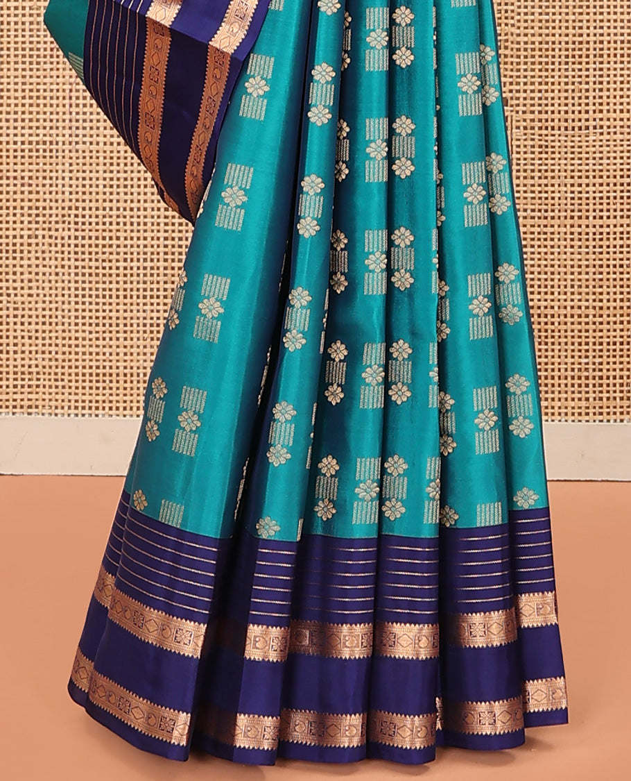 Blue Vasundhara Lite Silk Mix Saree Embellished with Zari Buttas, Complemented with a Contrast Border Depicting Rekku, Muthu, Diamond, and Manga Designs, Adorned with a Manga Design Pallu, and a Contrast Blouse