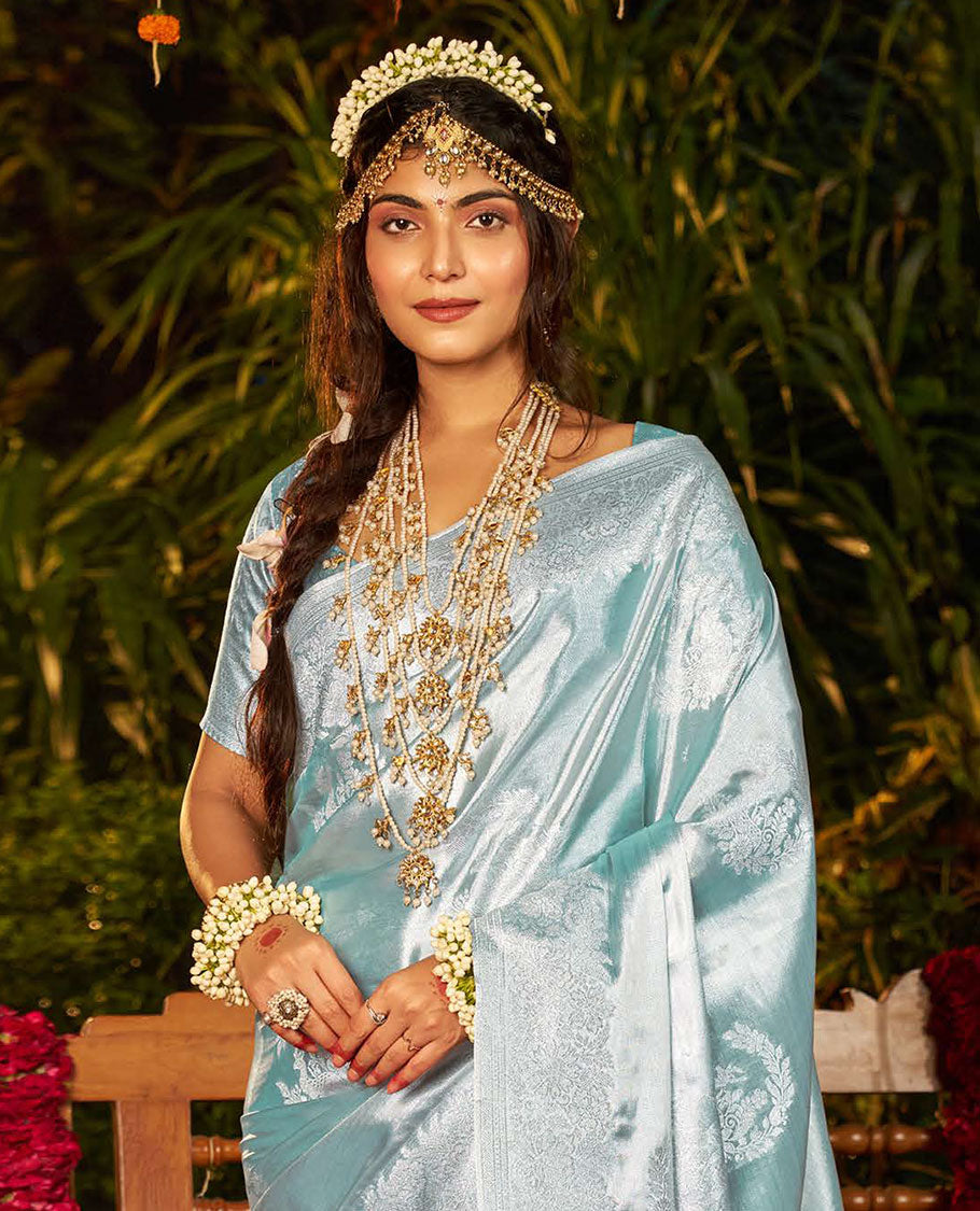 Pale Blue Designer Catalog Saree, Sparsely Woven with Floral Buttas All Over Its Body, Subtly Floral Design Border, Pallu Pictures Floral Designs, and Paired with a Matching Blouse