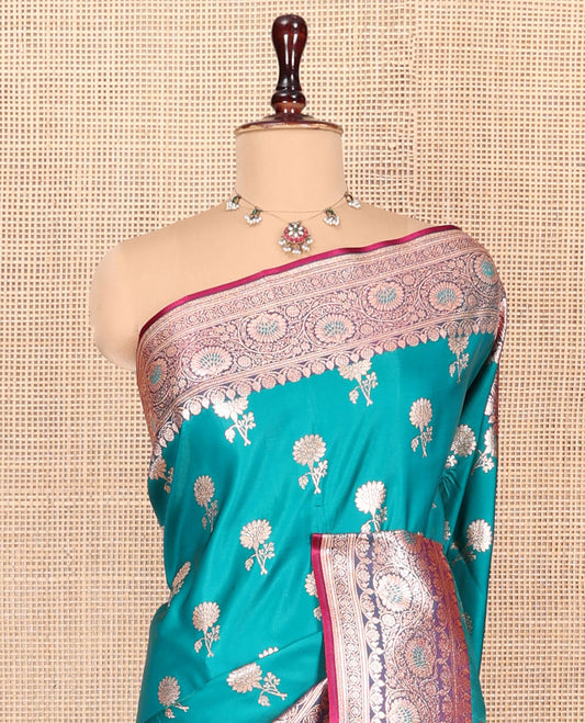 Blue Banarasi Nylon Saree, Detailed with Floral Buttas, Complemented by a Contrast Traditional Zari Border, Intricate Pallu, and a Contrast Blouse