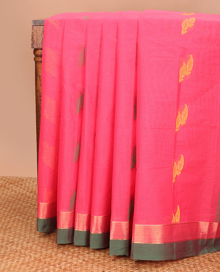 Pink buttas kanchi cotton saree, contrast zari border, and pallu of floral creeper, and leaf designs