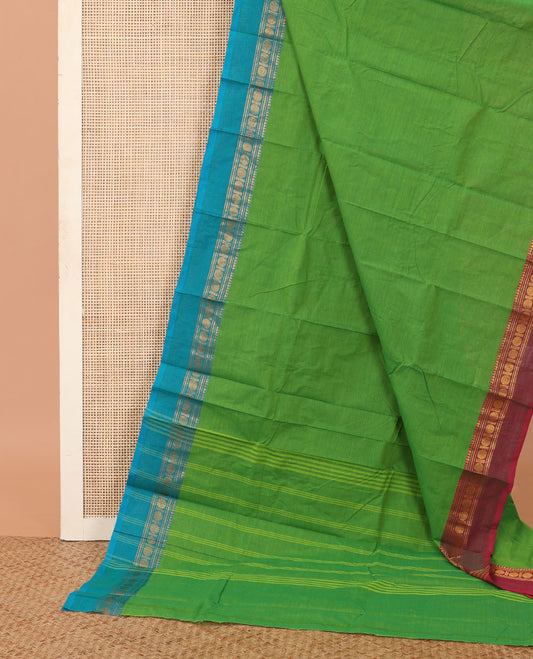 Green plain Chettinad cotton saree, contrast temple traditional ganga jamuna border, and striped pallu