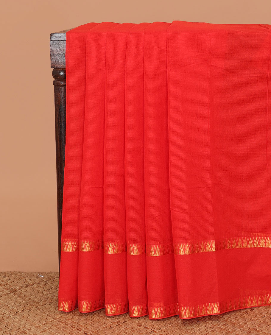 Red sparesly striped Mangalagiri Cotton saree, rettai pettu temple border, gleaming zari pallu, and contrast kalamkari floral printed blouse