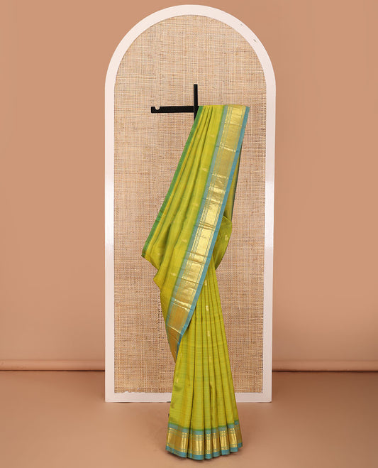 Green zari buttas Kanchipuram silk saree, contrast one-sided border of panner sombu,banaras & mayil kann & zari design pallu