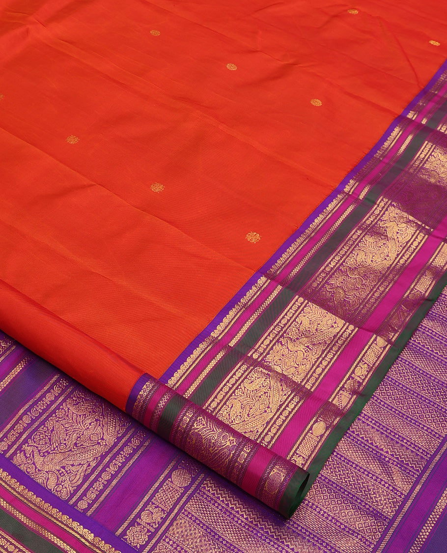 Orange zari buttas Kanchipuram silk saree, contrast border of manga mokku, banaras, kamalam, manga, rekku, mayil, and poun designs geometric patterned pallu