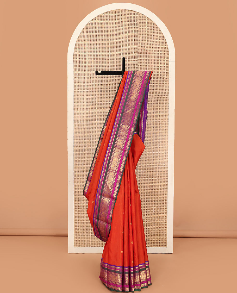 Orange zari buttas Kanchipuram silk saree, contrast border of manga mokku, banaras, kamalam, manga, rekku, mayil, and poun designs geometric patterned pallu