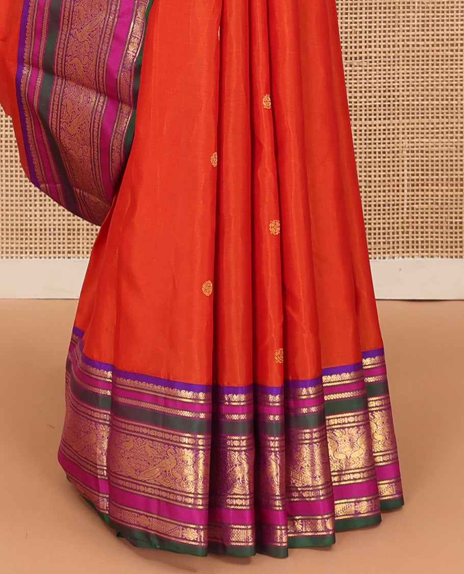 Orange zari buttas Kanchipuram silk saree, contrast border of manga mokku, banaras, kamalam, manga, rekku, mayil, and poun designs geometric patterned pallu