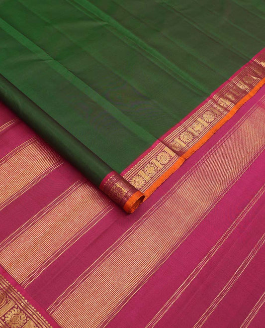 Green Plain Kanchipuram Silk Saree, Complemented by Contrast Border of Rekku, Banaras, Neli, Iruthalai Pakshi, and Manga Chakram Designs, Zari Design Woven Pallu, and Paired with a Contrast Blouse