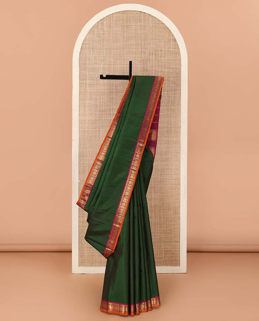 Green Plain Kanchipuram Silk Saree, Complemented by Contrast Border of Rekku, Banaras, Neli, Iruthalai Pakshi, and Manga Chakram Designs, Zari Design Woven Pallu, and Paired with a Contrast Blouse