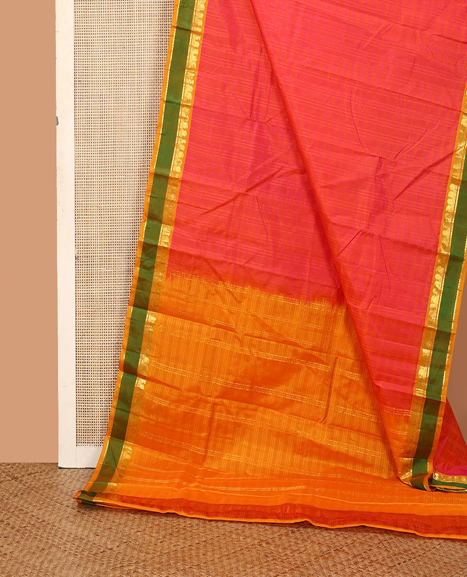Pink Kanchipuram silk saree, contrast rettai pettu border of manga, neli, and diamond designs, and zari striped pallu