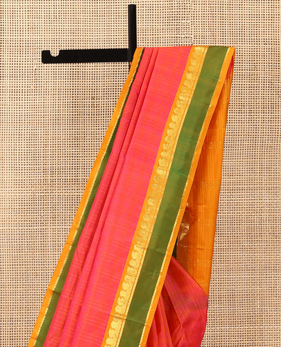 Pink Kanchipuram silk saree, contrast rettai pettu border of manga, neli, and diamond designs, and zari striped pallu