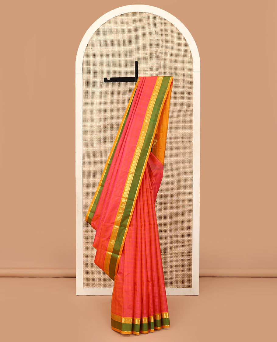 Pink Kanchipuram silk saree, contrast rettai pettu border of manga, neli, and diamond designs, and zari striped pallu