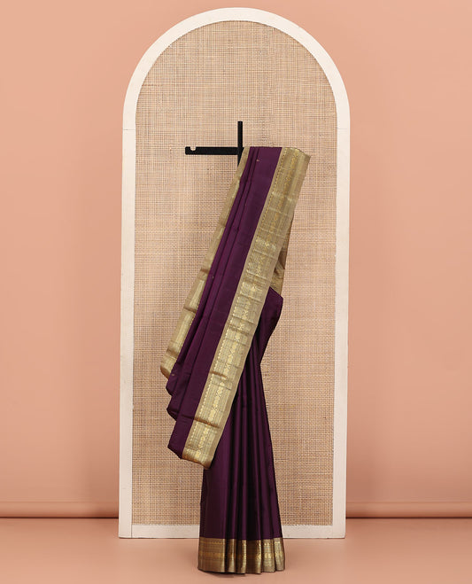 Purple Kanchipuram Silk Saree Prettified with Zari Buttas, Complemented by a Contrast Border Featuring Thazampoo Rekku, Neli, Muthu, and Jada Nagam Designs, Sparsely Woven Pallu, and Paired with a Contrast Blouse