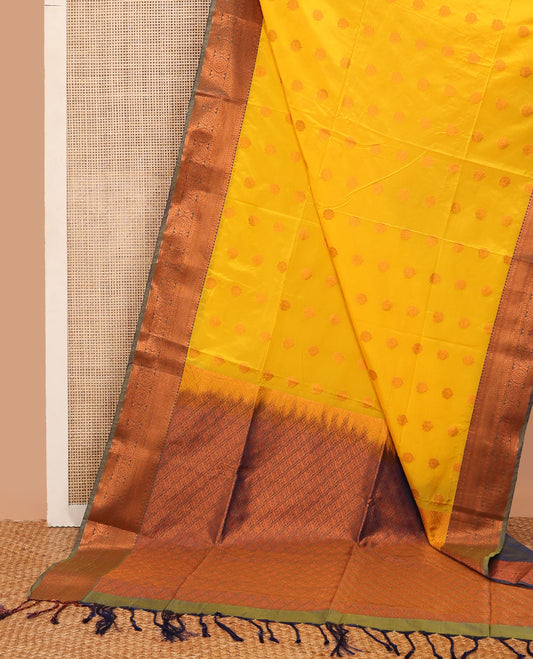 Yellow semi-soft silk saree with zari buttas, contrast traditional motifs zari border & pallu of jaal design