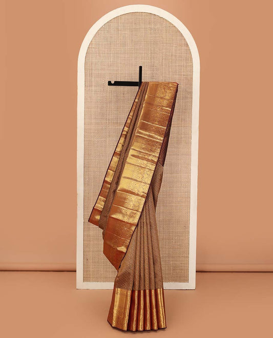 Maroon jacquard wedding silk saree, zari border of rekku, muthu, rudraksham, kamalam, then kuli kann, and mayil, and intricate pallu