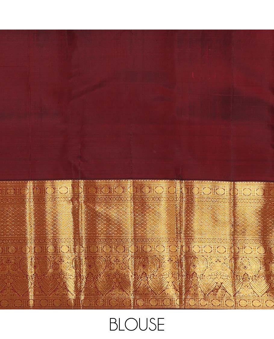 Maroon jacquard wedding silk saree, zari border of rekku, muthu, rudraksham, kamalam, then kuli kann, and mayil, and intricate pallu