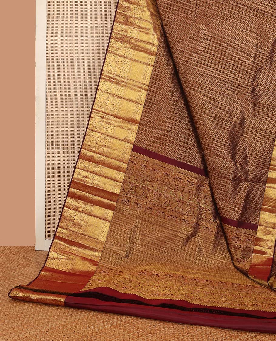 Maroon jacquard wedding silk saree, zari border of rekku, muthu, rudraksham, kamalam, then kuli kann, and mayil, and intricate pallu