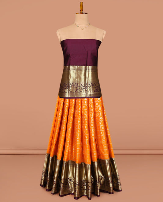 Orange Art Silk Pavadai Material Set, Gleamed Up with Buttas and Checks on Its Skirt, Complemented by a Contrast Traditional Zari Designs Border, and Paired with a Contrast Blouse