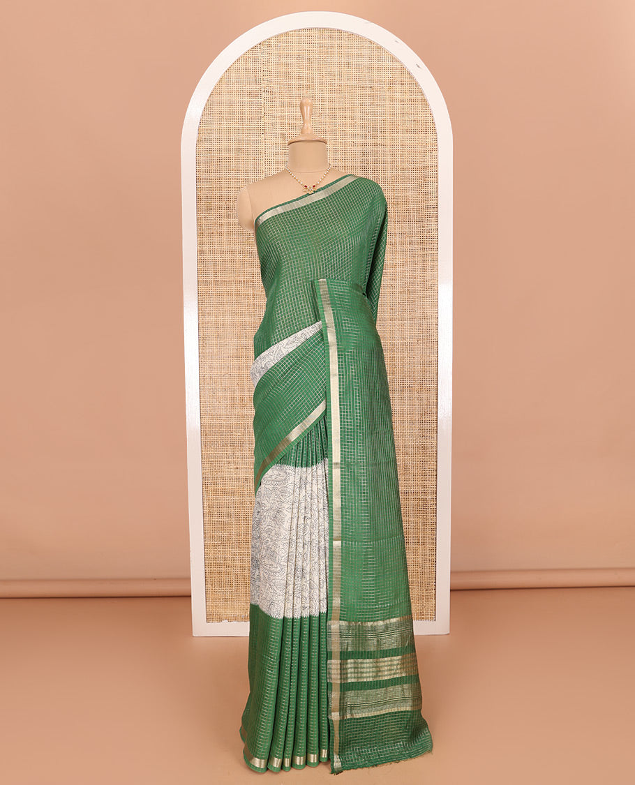 Green Assam Silk Saree Subtly Sparkled with Micro-Checks and Kalamkari Floral Prints, Featuring a Simple Piping Border, a Pallu Woven with Zari Stripes, Paired with a Matching Checked Blouse