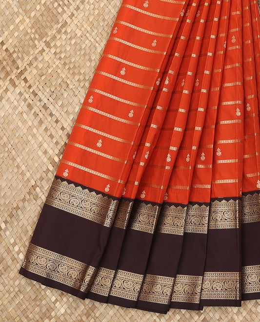 Rust orange zari buttas and striped budget silk saree, contrast traditional zari rettai pettu border, and jaal pallu