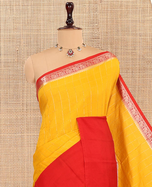 Yellow Assam Silk Saree, Sparsely Woven with Zari Checks on Its Body, Complemented by a Captivating Contrast Border of Peacock Designs, Pallu Adorned with Zari Stripes, and Paired with a Contrast Blouse