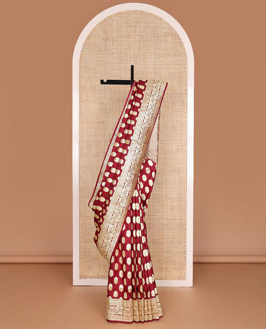Maroon banarasi silk saree with zari buttas, self-border of floral creeper designs & pallu steeped with floral designs