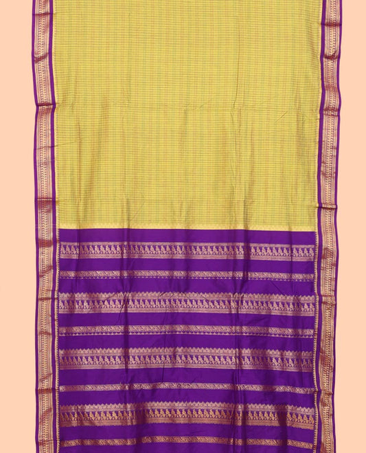 Green checked nine-yard cotton saree, contrast temple traditional zari border of peacocks, and traditional design pallu