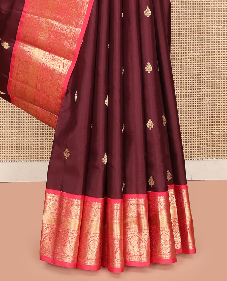 Brown Vasundhara Silk Saree, Decorated with Zari Buttas on Its Body, Complemented by a Contrast Traditional Zari Border of Mayil Designs, Grand Pallu Depicts Jaal and Floral Designs, and Paired with a Contrasting Blouse