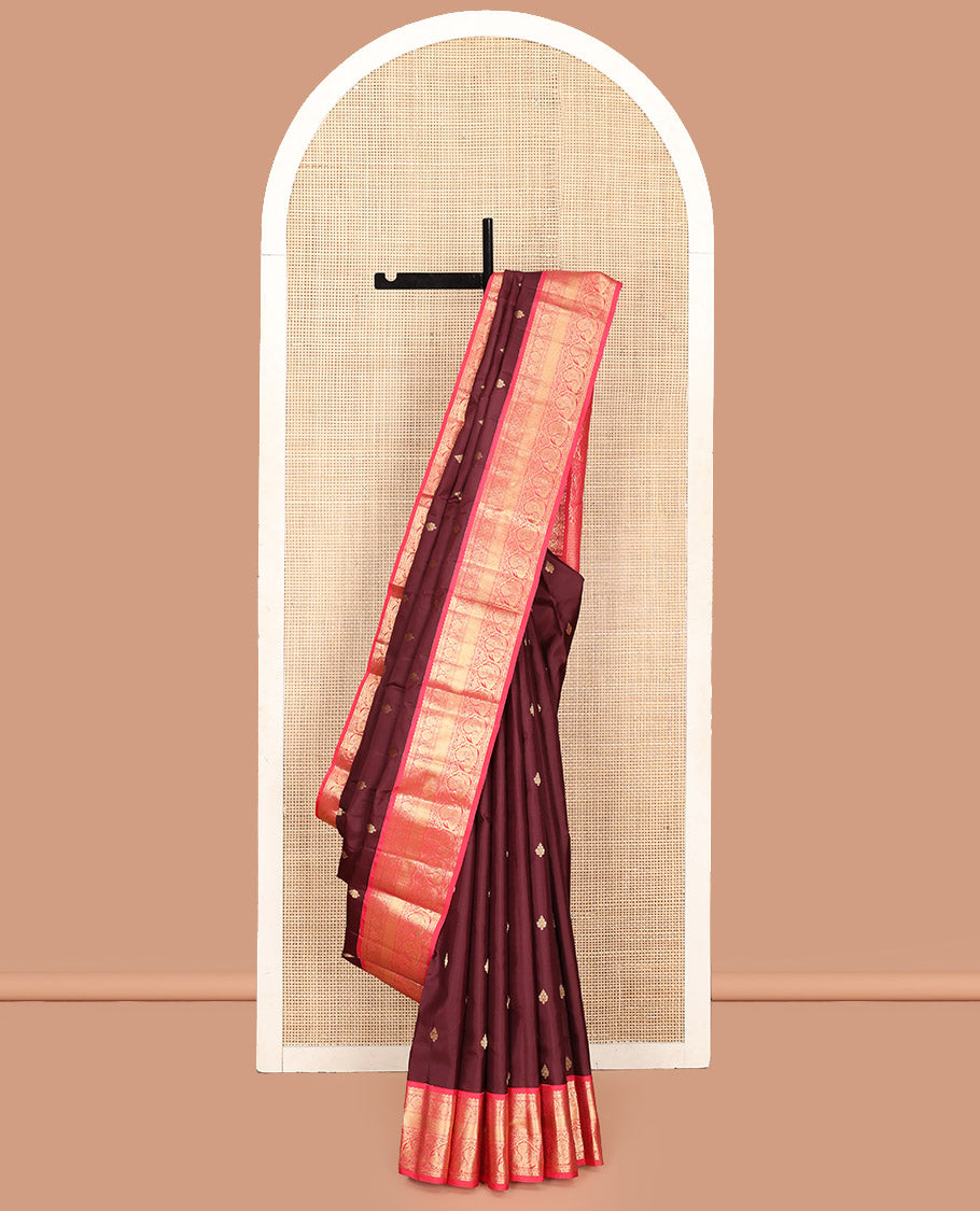 Brown Vasundhara Silk Saree, Decorated with Zari Buttas on Its Body, Complemented by a Contrast Traditional Zari Border of Mayil Designs, Grand Pallu Depicts Jaal and Floral Designs, and Paired with a Contrasting Blouse
