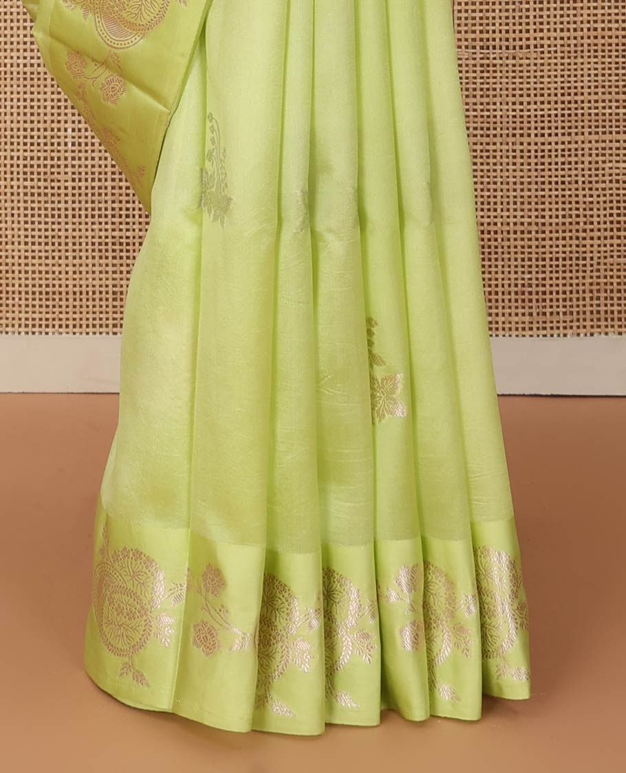 Green floral buttas raw mango silk saree, floral design border, and pallu adorned with floral, and geometric zari designs