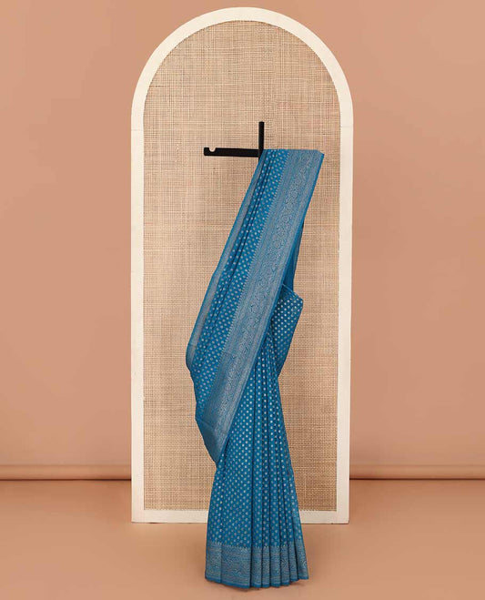Blue zari buttas fancy saree, zari floral creeper border, and pallu steeped with intricate buttas