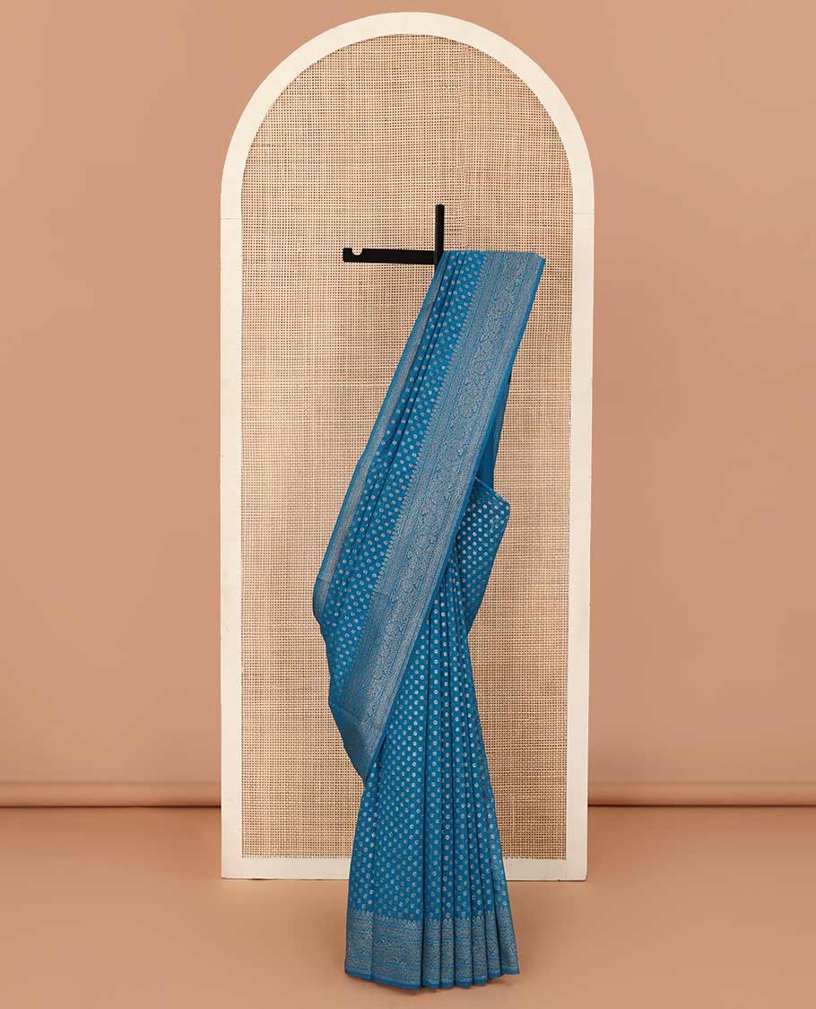 Blue zari buttas fancy saree, zari floral creeper border, and pallu steeped with intricate buttas