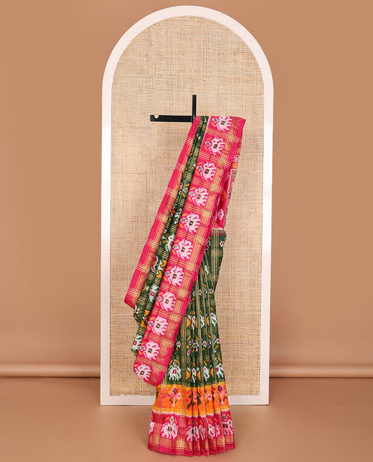 Green patola-style animal motif enclosed checked ikkat saree, contrast elephant motif border & pallu of ikkat designs