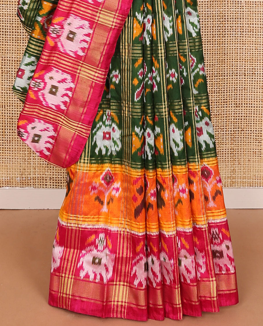 Green patola-style animal motif enclosed checked ikkat saree, contrast elephant motif border & pallu of ikkat designs