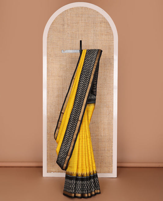 Yellow butta & checked pure ikkat saree, contrast temple ikkat black border & pallu of geometric patterns