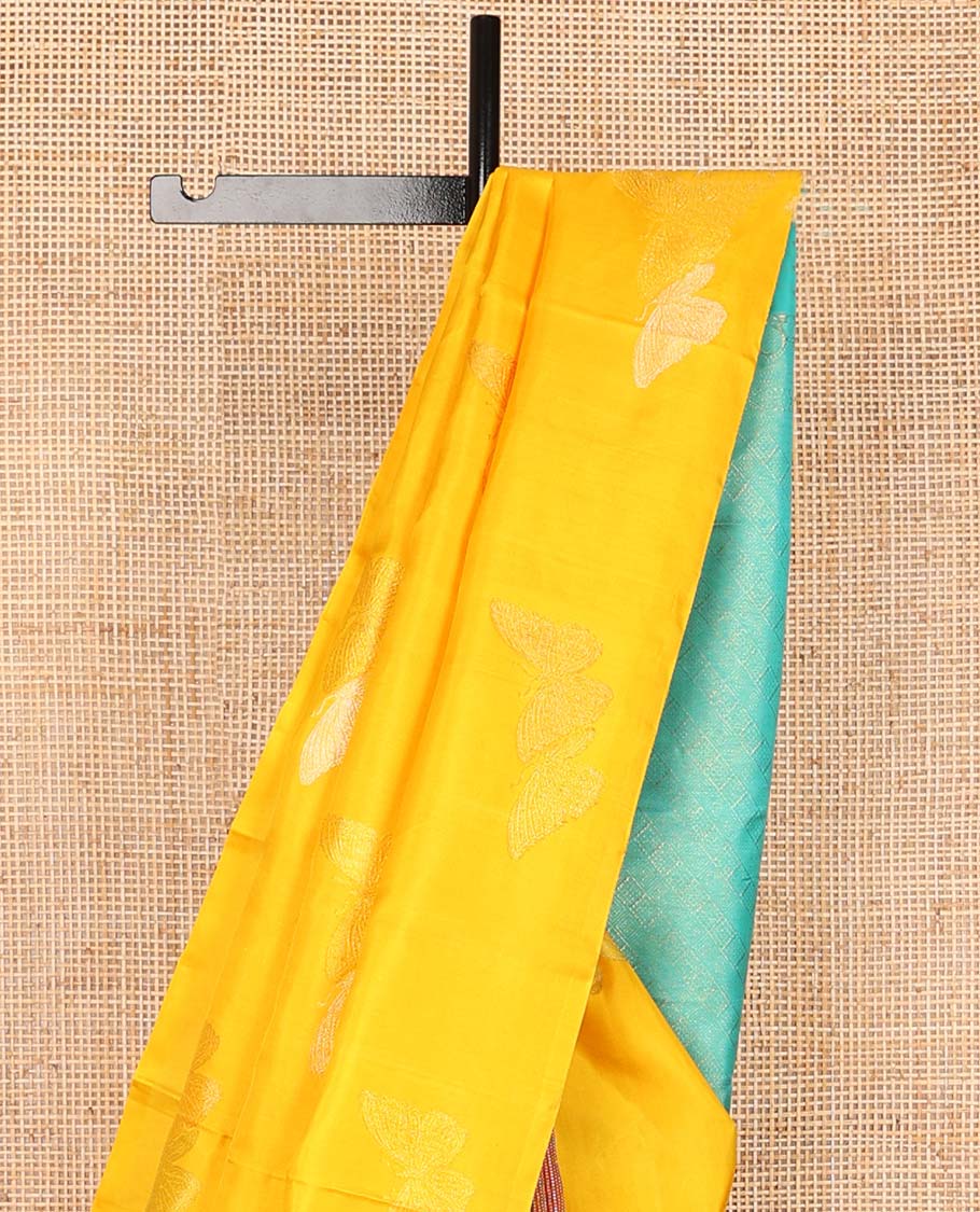 Borderless orange buttas kancheepuram silk saree with argyle design pallu