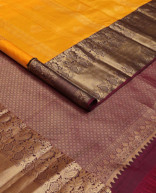 Orange zari designs silk saree, contrast border of mayil, chakram, & kuyil kann & jaal pallu