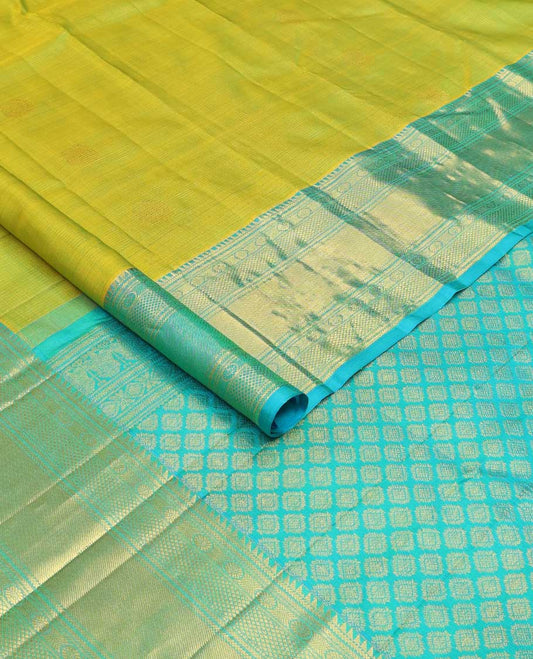 Leaf green zari buttas checked Kanchipuram silk saree, contrast border of ara bogudi,chakram and kuyil kann and jaal pallu