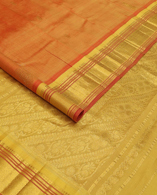 Orange zari buttas Kanchipuram silk saree, contrast one-sided border of panner sombu, muthu, banaras, and jaal, and floral creeper pallu