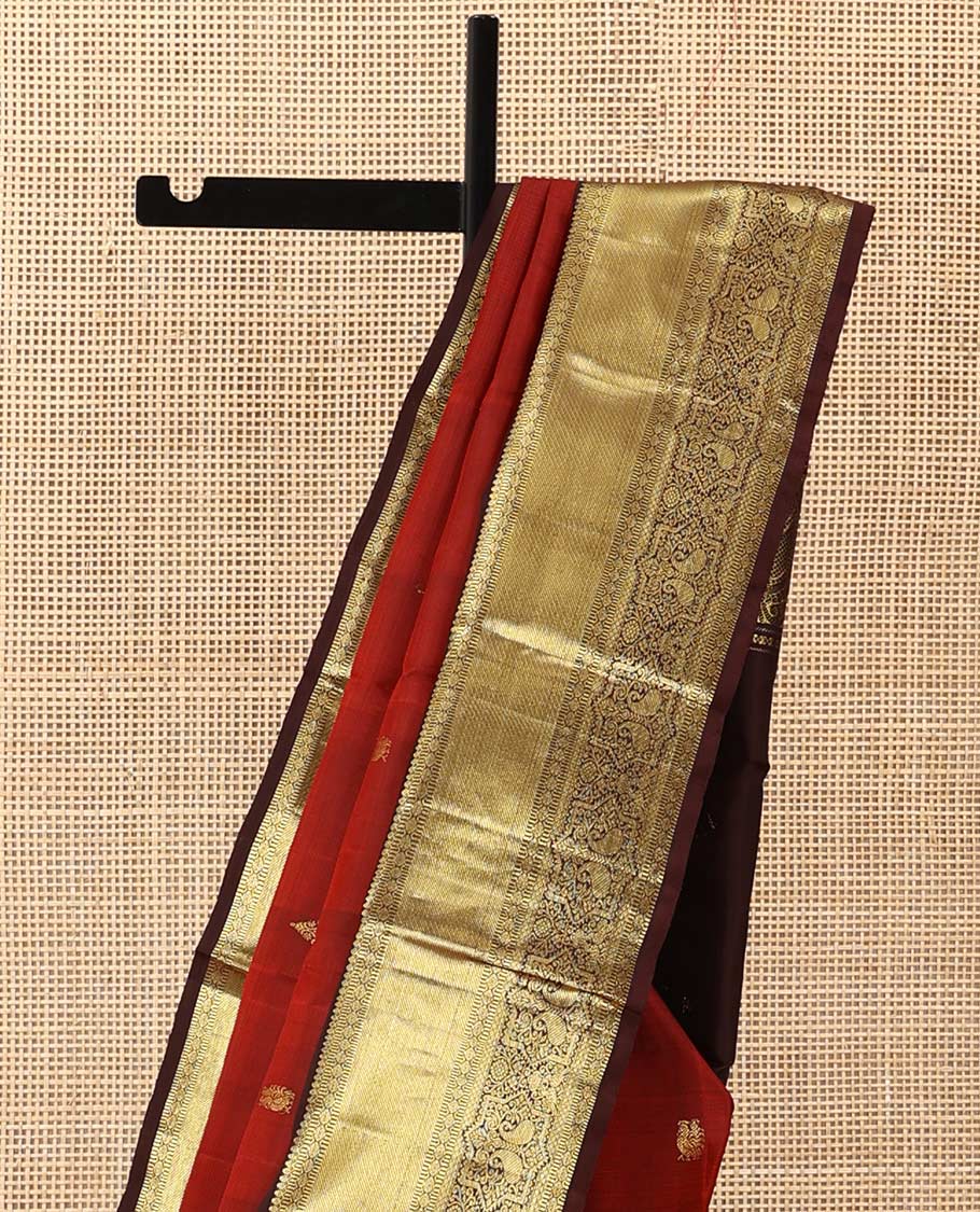 Rust zari buttas Kanchipuram silk saree, contrast border of thilakam mokku, muthu, poun, mayil kann, and manga designs, and zari design pallu