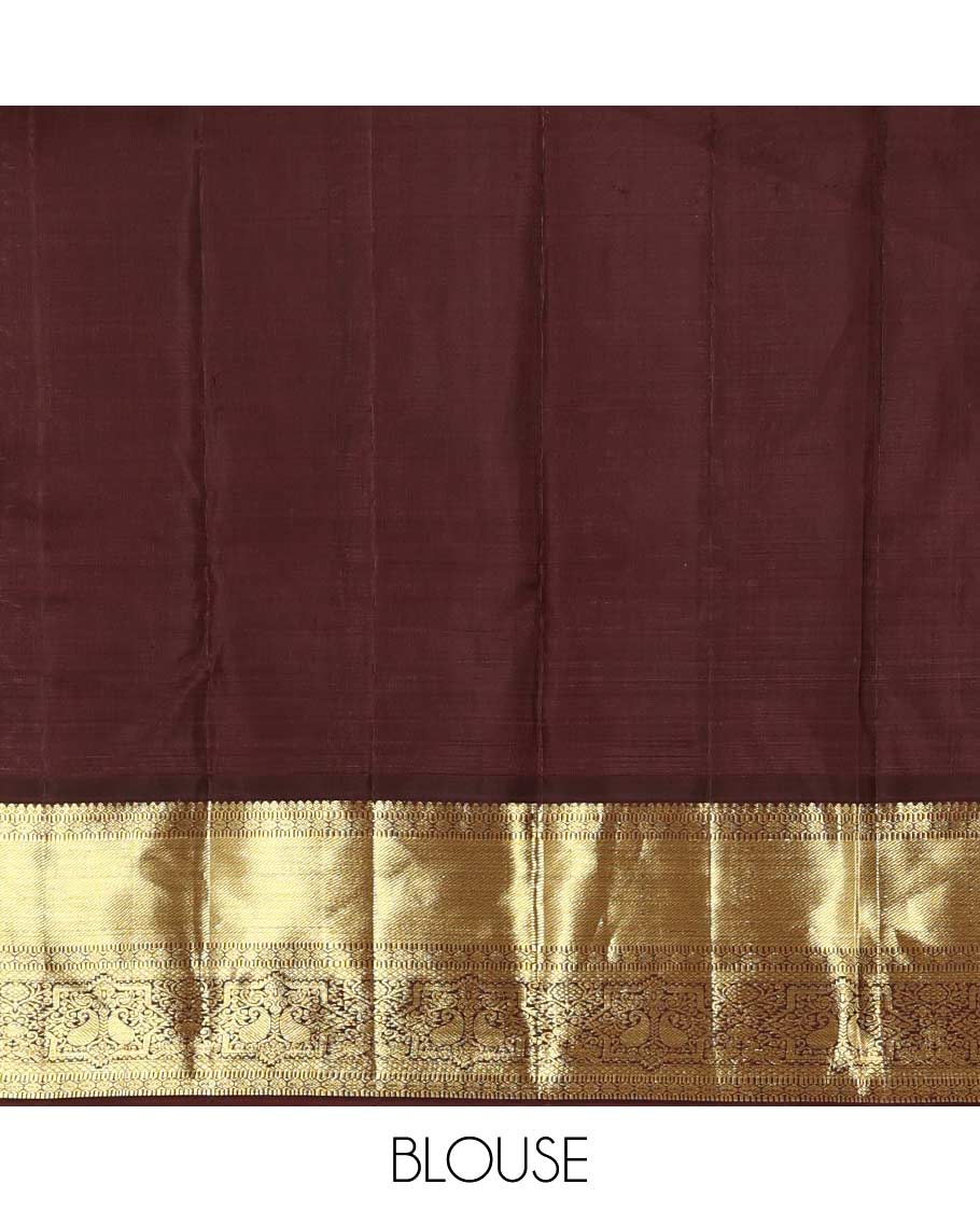 Rust zari buttas Kanchipuram silk saree, contrast border of thilakam mokku, muthu, poun, mayil kann, and manga designs, and zari design pallu